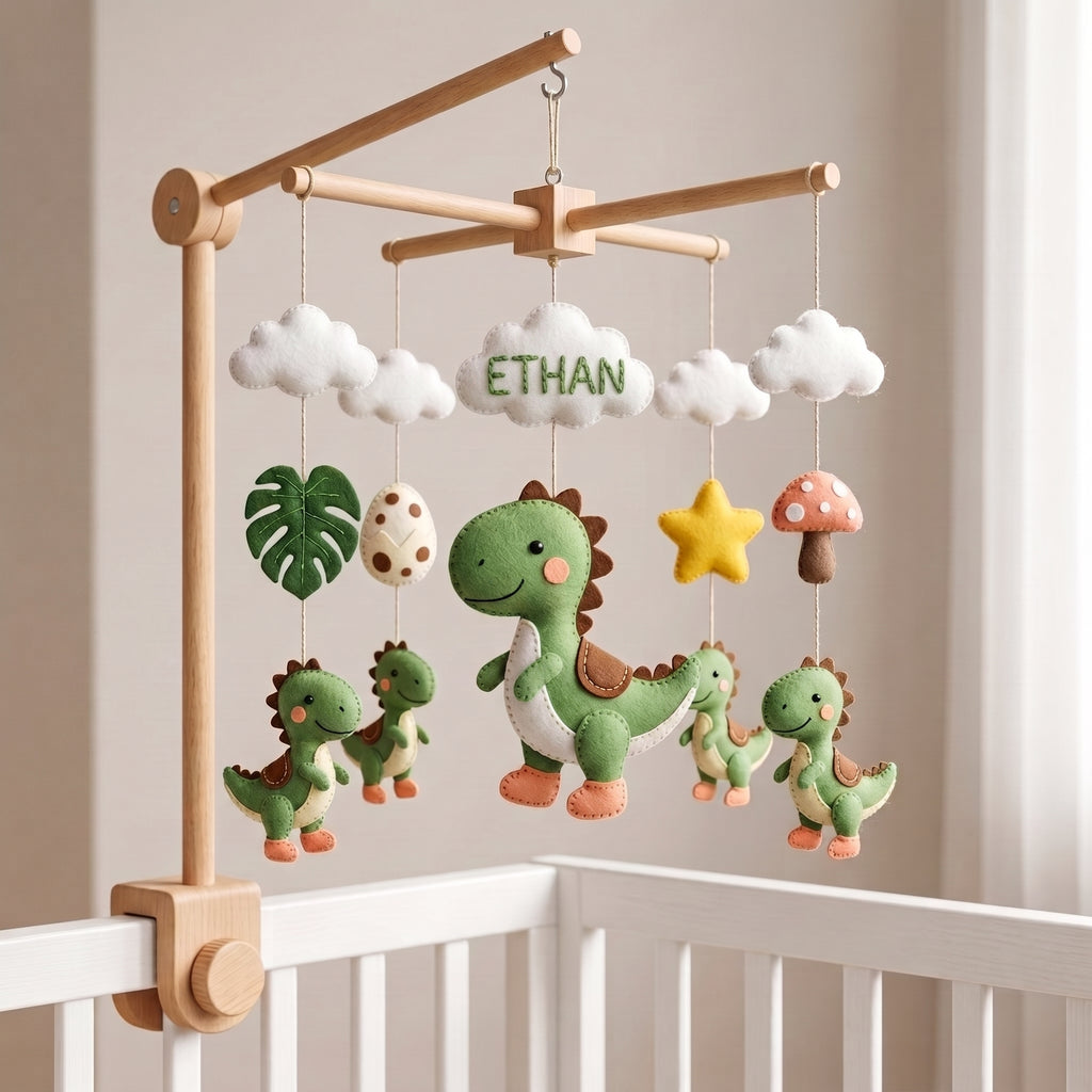 Handmade personalized dinosaur felt baby mobile above a white crib